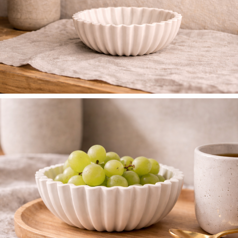 White resin bowl with grapes on a wooden surface
