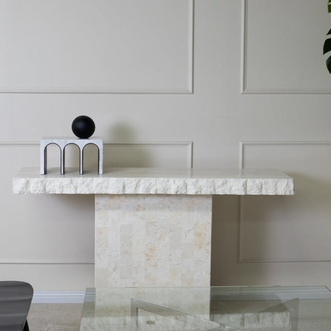 arches decor sculpture on a luxuirous and modern console table. Triple Arched object made from resin and marble. A ball object sits on the top of the sculpture.