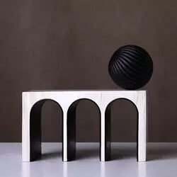 Triple Arched object made from resin and marble. A ball object sits on the top of the sculpture.